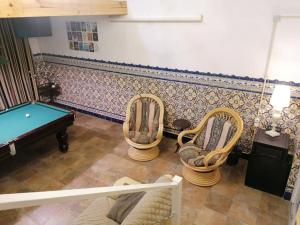 an overhead view of a pool table and chairs at Estalagem da Liberdade in Portalegre