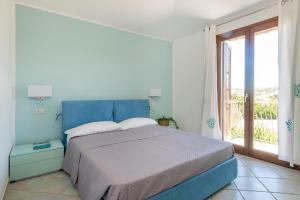 A bed or beds in a room at Villaggio Turchese