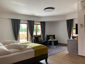 Posteľ alebo postele v izbe v ubytovaní OG's Golf Lodge