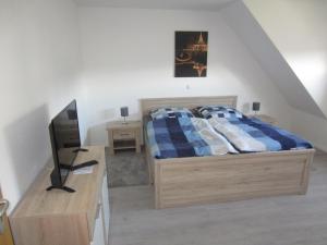 Postel nebo postele na pokoji v ubytování Ferienhaus Middenin