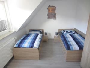 Postel nebo postele na pokoji v ubytování Ferienhaus Middenin
