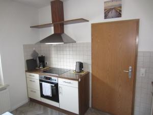 Kuchyň nebo kuchyňský kout v ubytování Ferienhaus Middenin