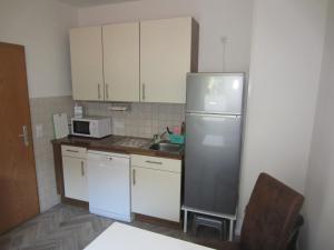 Kuchyň nebo kuchyňský kout v ubytování Ferienhaus Middenin + 8 fotografií