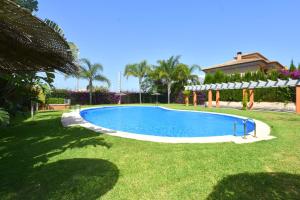 a swimming pool in the yard of a house at Apartamento Nueva Fontana in Jávea