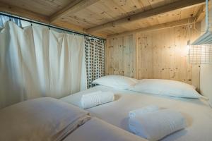 Ένα ή περισσότερα κρεβάτια σε δωμάτιο στο Ostello Antagonisti