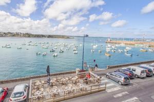 a view of a harbor with boats in the water at Le Matelot in Erquy