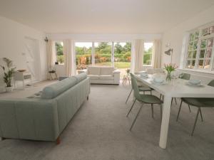 a living room with a couch and a table at Thames Reach in Wallingford