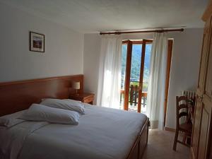 Postel nebo postele na pokoji v ubytování Albergo Miravalle