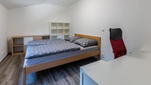 Postel nebo postele na pokoji v ubytování Apartmán U Křížku
