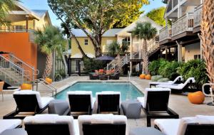 a swimming pool in a courtyard with chairs at Truman Hotel in Key West