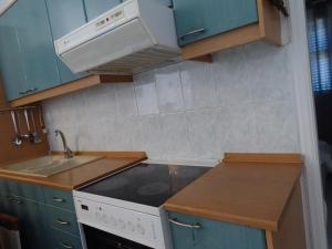 Kuchyň nebo kuchyňský kout v ubytování NAMA Beach house