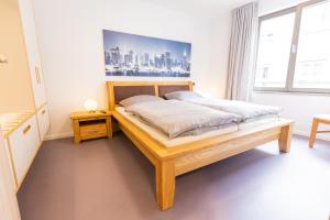 Ένα ή περισσότερα κρεβάτια σε δωμάτιο στο Ferienwohnungen Noah zu Erfurt
