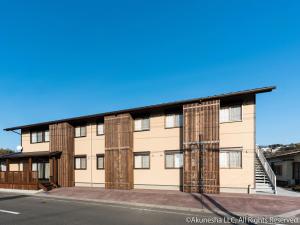 an apartment building with a large building at Oyado Midokoi in Akune