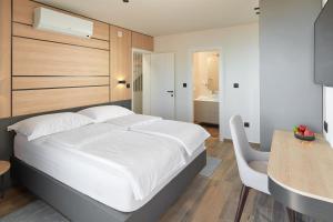 Posteľ alebo postele v izbe v ubytovaní Sun Spalato Villas