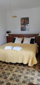 เตียงในห้องที่ Villa Magnolia BB, Lago Maggiore (Massino Visconti, Italy)