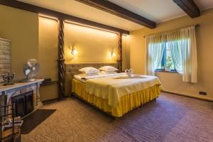 Postel nebo postele na pokoji v ubytování Ruunawere Hotel