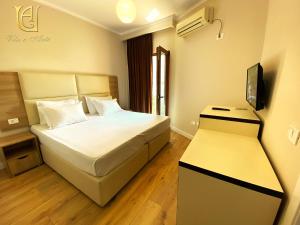 Postel nebo postele na pokoji v ubytování Hotel Vila e Arte City Center