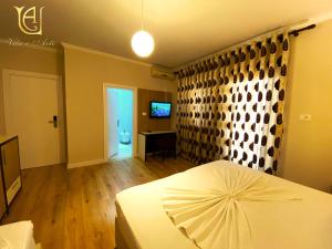 Postel nebo postele na pokoji v ubytování Hotel Vila e Arte City Center
