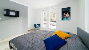 Posteľ alebo postele v izbe v ubytovaní Apartamenty EverySky - Dom Orkana 9