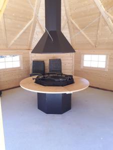 a room with a stove in a building at LE PRE DE L AIR in Saint-Michel-Mont-Mercure