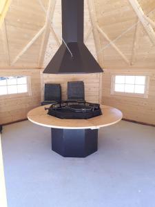 a room with a stove in a building at LE PRE DE L AIR in Saint-Michel-Mont-Mercure +9 photos