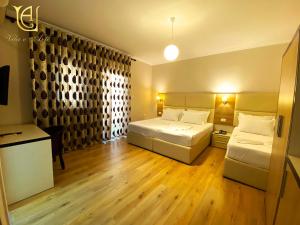 Postel nebo postele na pokoji v ubytování Hotel Vila e Arte City Center