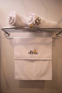 two towels on a towel rack in a bathroom at Dedanau Hotel in Bedugul