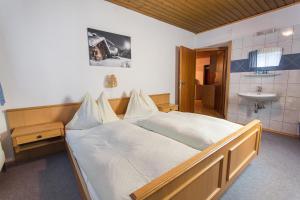 En eller flere senge i et værelse på Appartements Grabenbauer