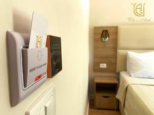 Postel nebo postele na pokoji v ubytování Hotel Vila e Arte City Center
