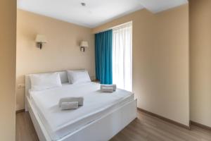 Postel nebo postele na pokoji v ubytování Orbi Beach Tower Hotel Official