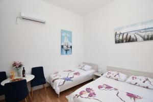 Кровать или кровати в номере Apartmani Rina