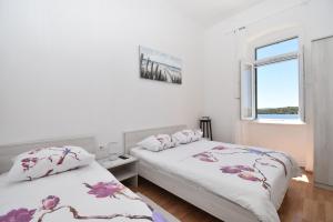 Кровать или кровати в номере Apartmani Rina