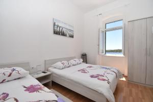 Кровать или кровати в номере Apartmani Rina