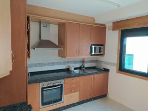 A kitchen or kitchenette at Apartamento XOSÈ Sanxenxo