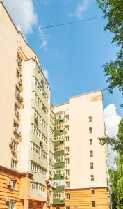 an apartment building in front of a blue sky at Рыбальская 8 in Kyiv