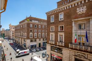 a view of a street in a city with buildings at Stay Inn Rome Via Del Corso in Rome