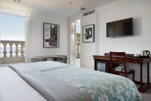 Postel nebo postele na pokoji v ubytování Hotel de Londres y de Inglaterra