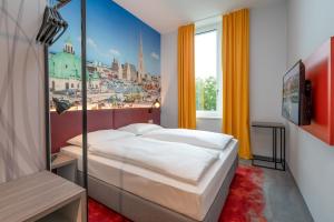 Postel nebo postele na pokoji v ubytování Campanile Vienna South