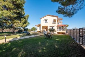 a villa with a view of the yard at Pine trees apartment in Preveza