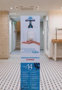 a sign in the hallway of a building at Atrium Taş Otel in Cesme +33 photos