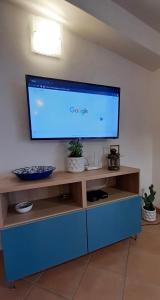 TV a/nebo společenská místnost v ubytování Casa Diletta
