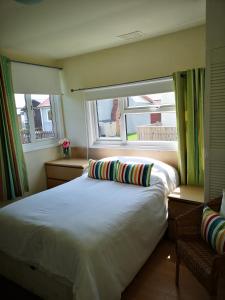 Postel nebo postele na pokoji v ubytování 35 South Shore.