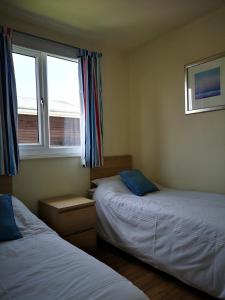 Postel nebo postele na pokoji v ubytování 35 South Shore.