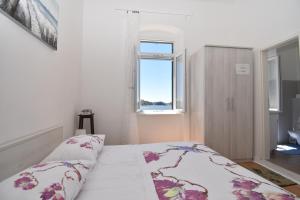 Кровать или кровати в номере Apartmani Rina