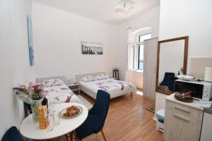 Кровать или кровати в номере Apartmani Rina