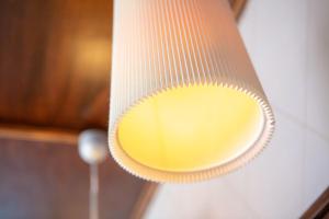 a yellow light hanging from a ceiling at Comfort Hotel tom Kyle in Kiel