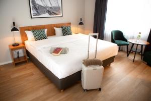 Postel nebo postele na pokoji v ubytování Comfort Hotel tom Kyle