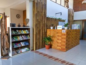 a store with a book shelf and a counter at Griya Jagadhaya in Bantul