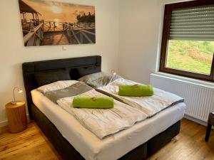 Кровать или кровати в номере Apartmenthaus RuheZeit