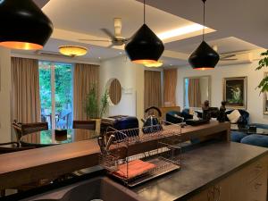 a kitchen and living room with a living room at 6ix Senses Boutique Villa in Ipoh